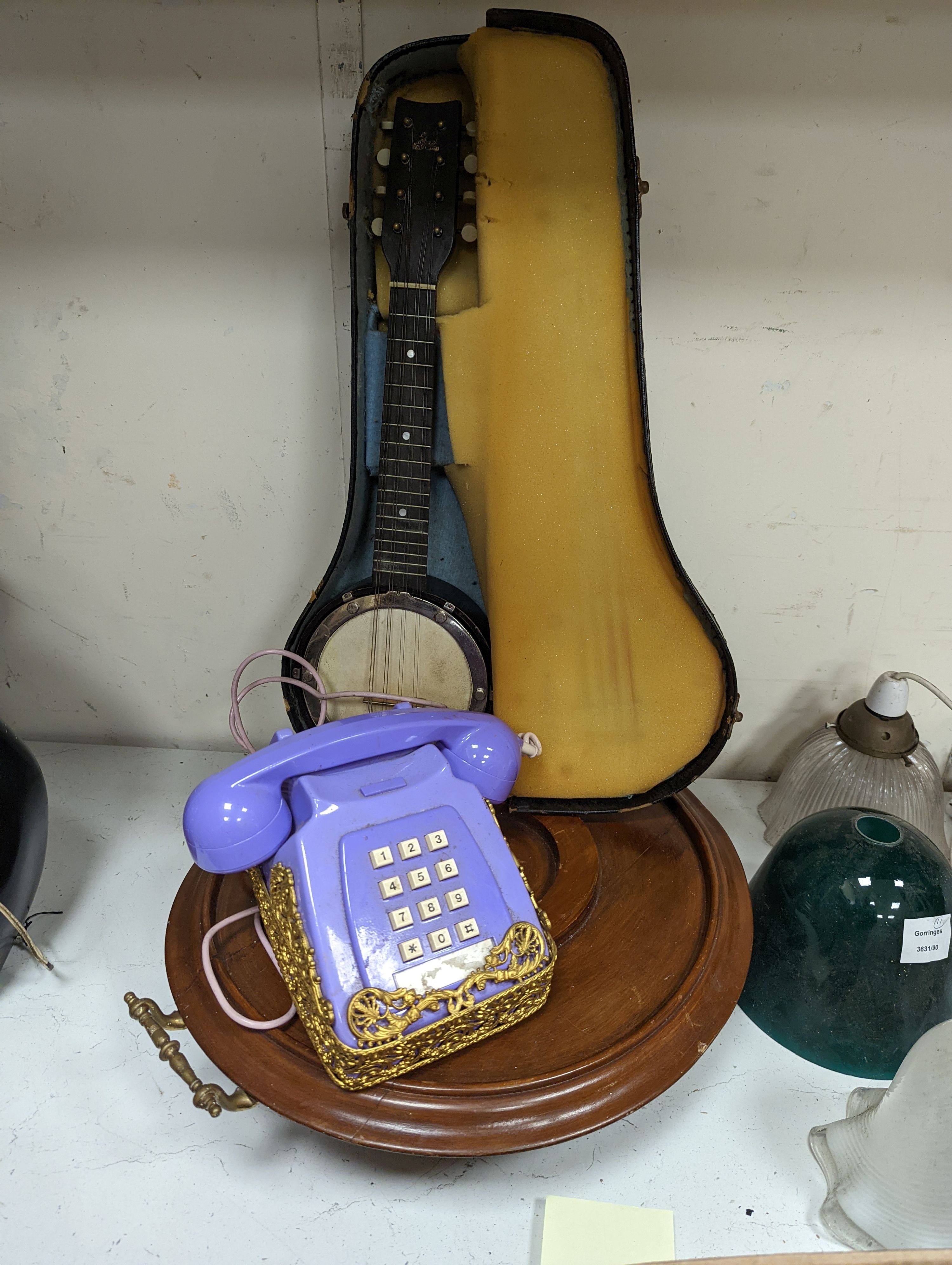 A cased miniature banjo, gilt metal mounted telephone and a mahogany lazy susan (a.f.)